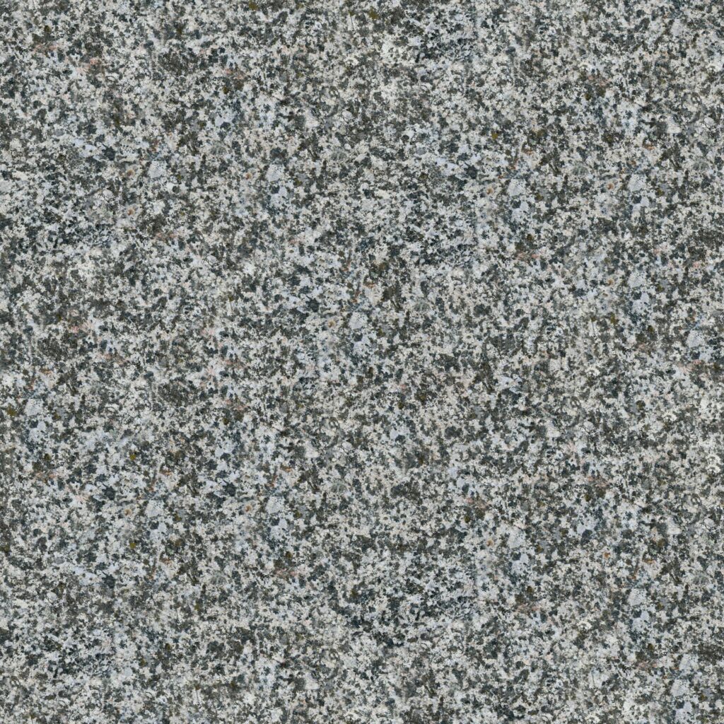 Gros plan sur une surface de granit gris à texture granuleuse et rugueuse